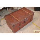 A large leather trunk fitted two straps, two side