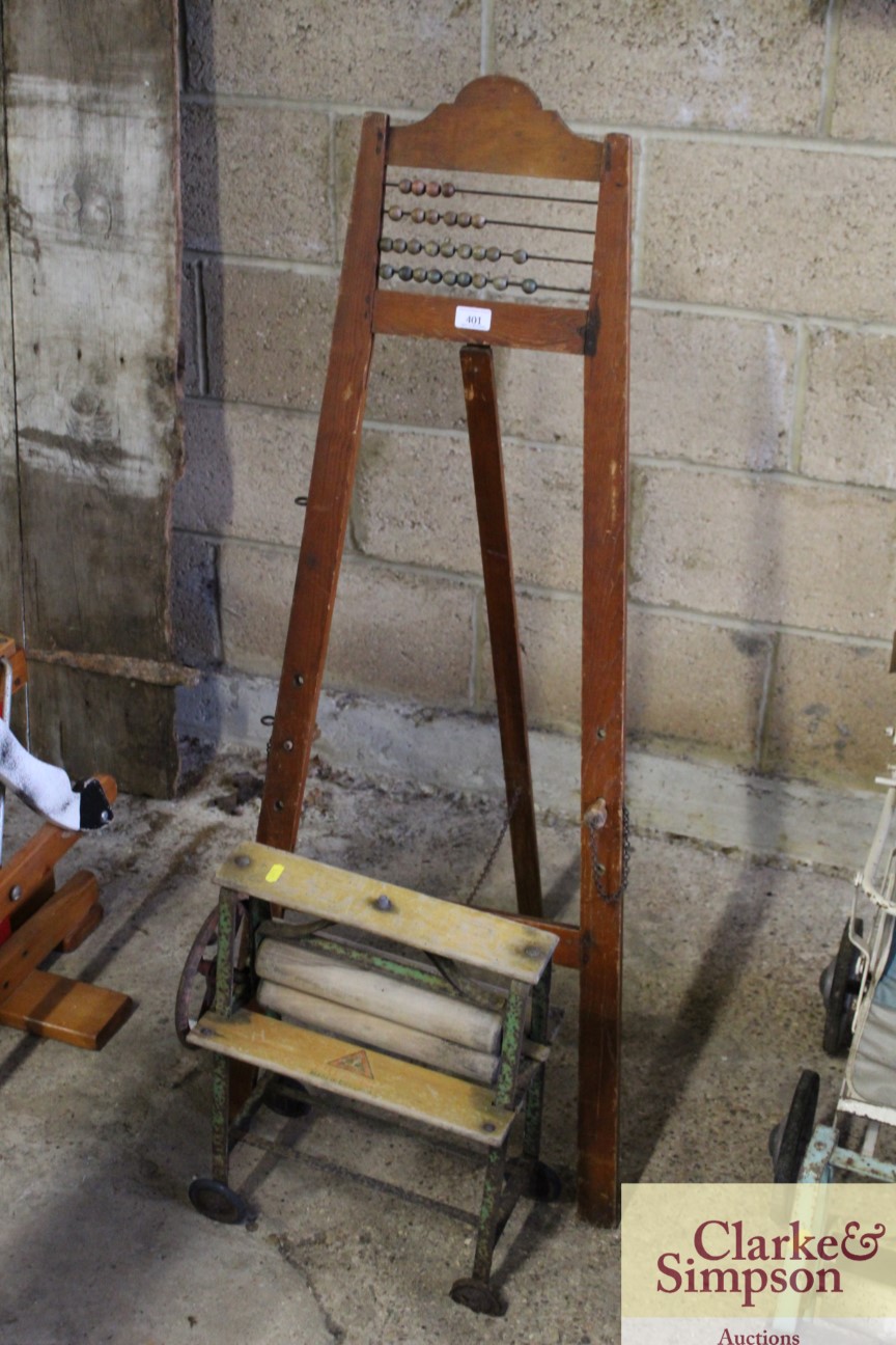 A vintage child's mangle and an abacus / easel