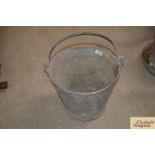 A galvanised riveted pail with swing handle