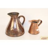 Two antique copper jugs