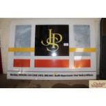 A "JPS" plastic advertising sign, approx. 20" x 29
