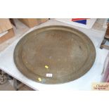 An Eastern circular brass tray