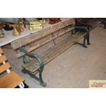 A cast iron and wooden slatted railway type bench