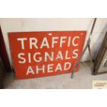 A metal traffic "Signals Ahead" warning sign, approx. 30"