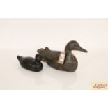 One large and one small wooden decoy duck