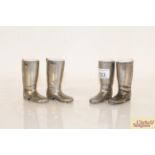Two pairs of white metal miniature boots with chin