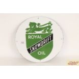 A circular enamel sign for "Royal Snowdrift Oil",