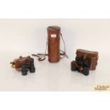 A pair of Lumrop 8 x 25 binoculars and leather cas