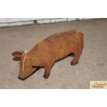 A small cast iron model pig