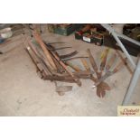 A quantity of various long handled tools etc.