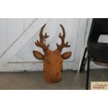 A rusty cast iron stags head