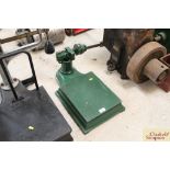 A set of green cast iron platform scales and weigh