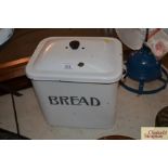 A vintage enamel bread bin