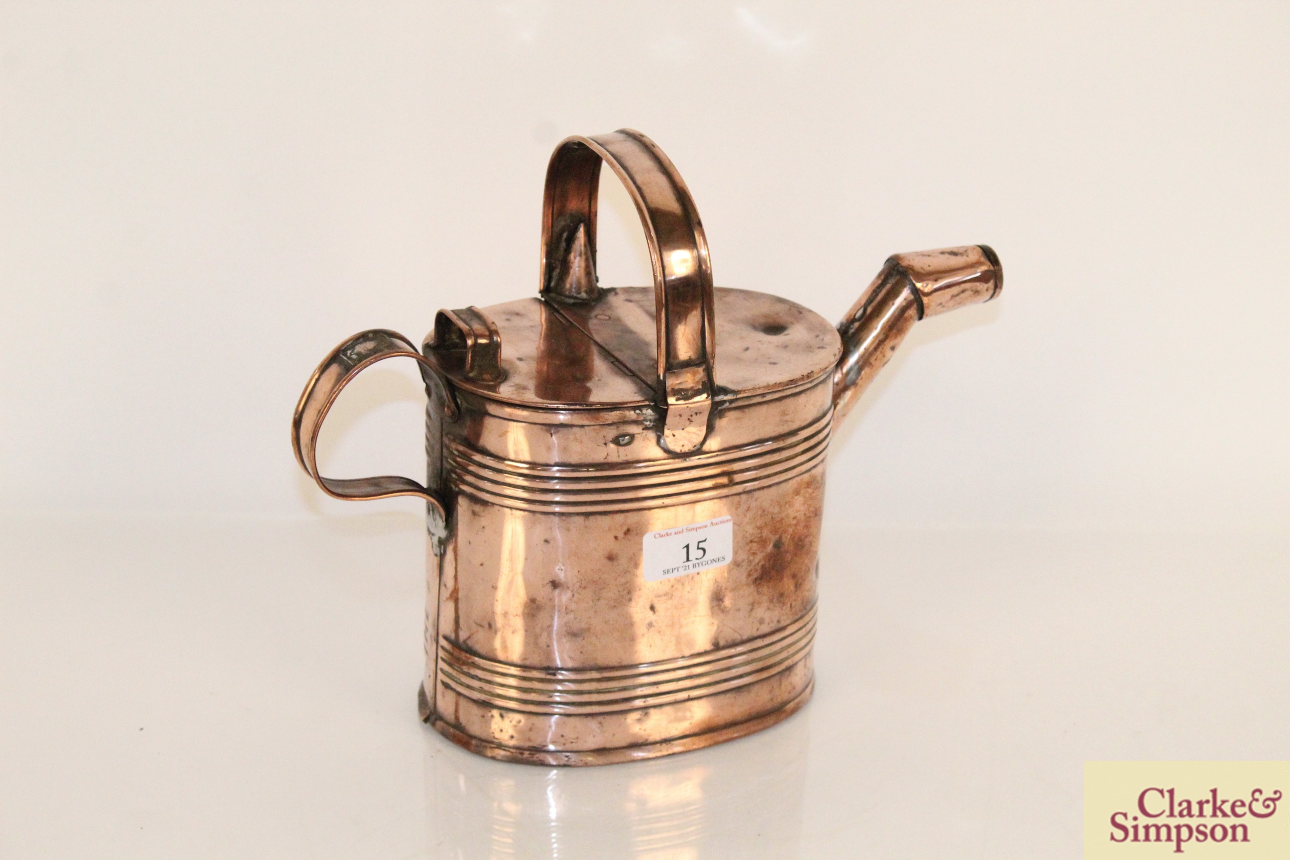 An antique copper Country House watering can