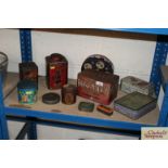A collection of vintage advertising tins including