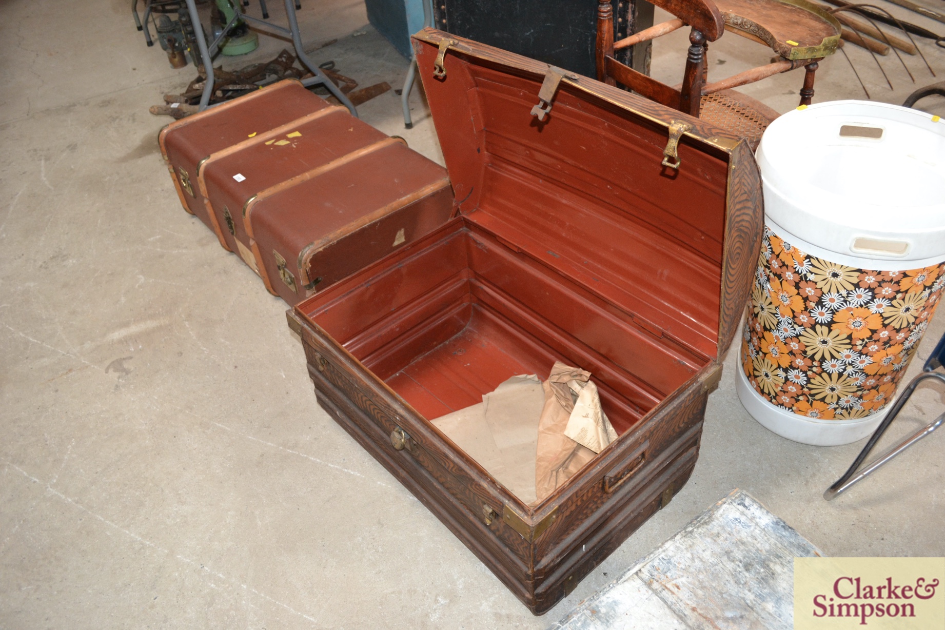 A Victorian japanned dome topped tin trunk