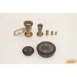 A set of brass graduated weights from 1lb to ¼oz,