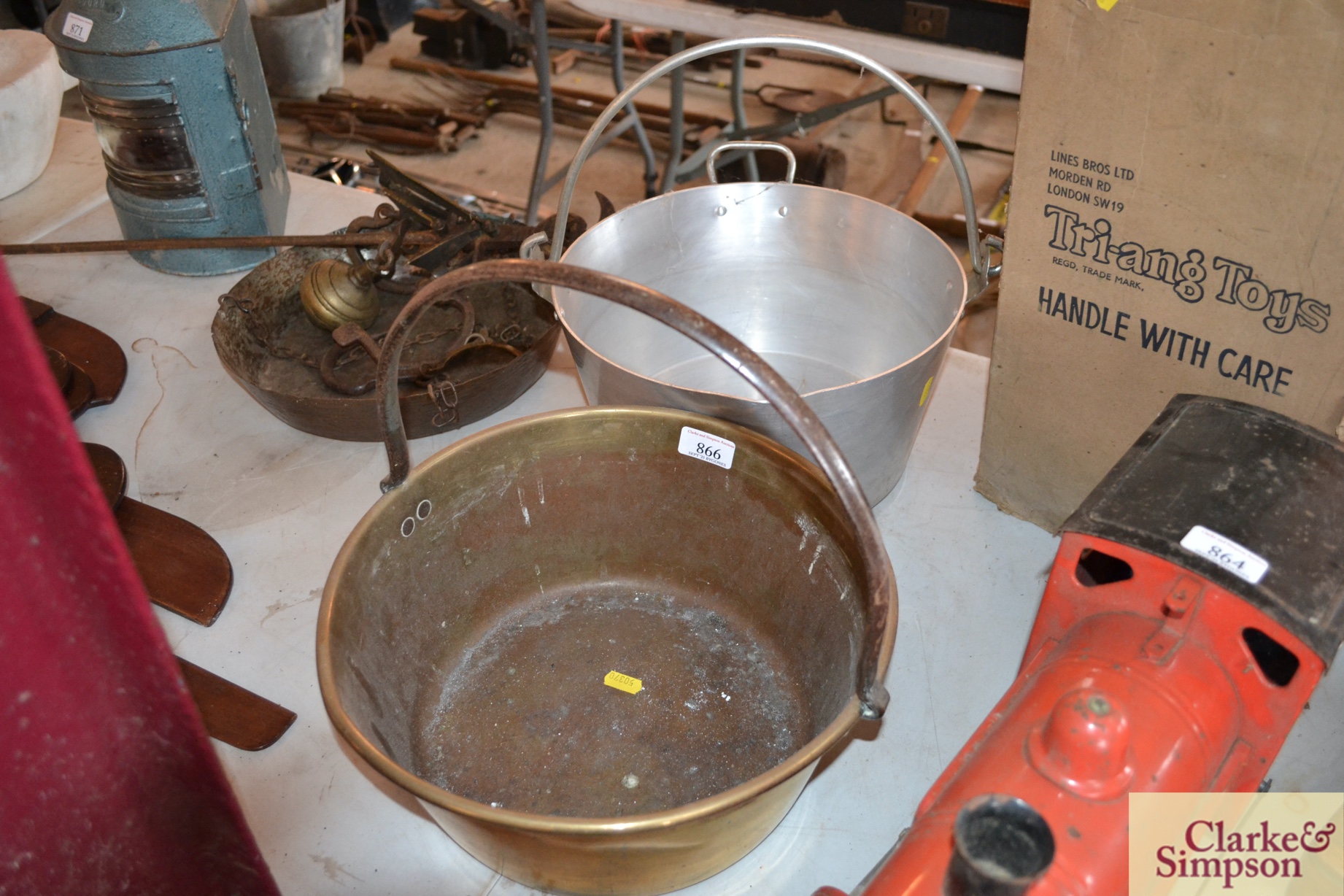 An antique brass preserve pan with iron handle an