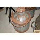 A old milk churn with swing handle