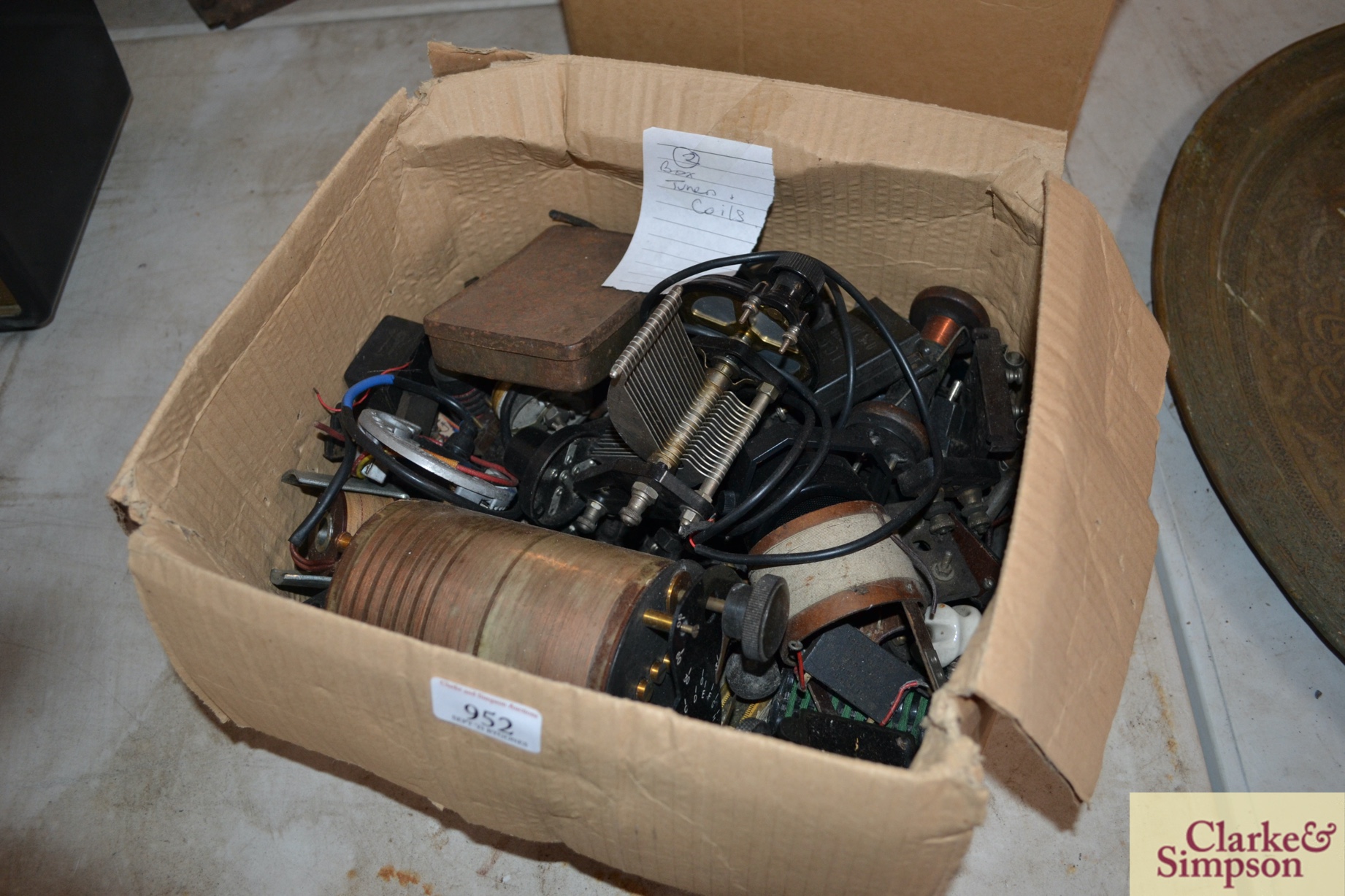A box of miscellaneous vintage radio tuners and coi