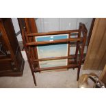 An Edwardian mahogany towel rail