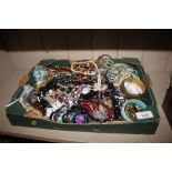 A box of miscellaneous costume jewellery, beads an