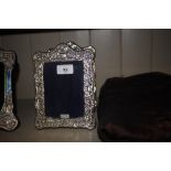 A pair of silver mounted easel photograph frames