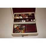 A cantilever jewellery box and contents to include