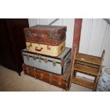 A wooden bound travelling trunk; another travellin