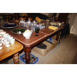 A late Victorian mahogany extending dining table w