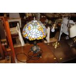 A Tiffany style table lamp and shade