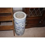 A blue and white Chinese umbrella stand