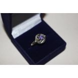 A 925 silver gilt ring set with amethyst coloured