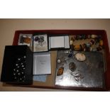 A box of jewellery to include silver backed pendan