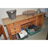 A heavy oak desk with seven drawers