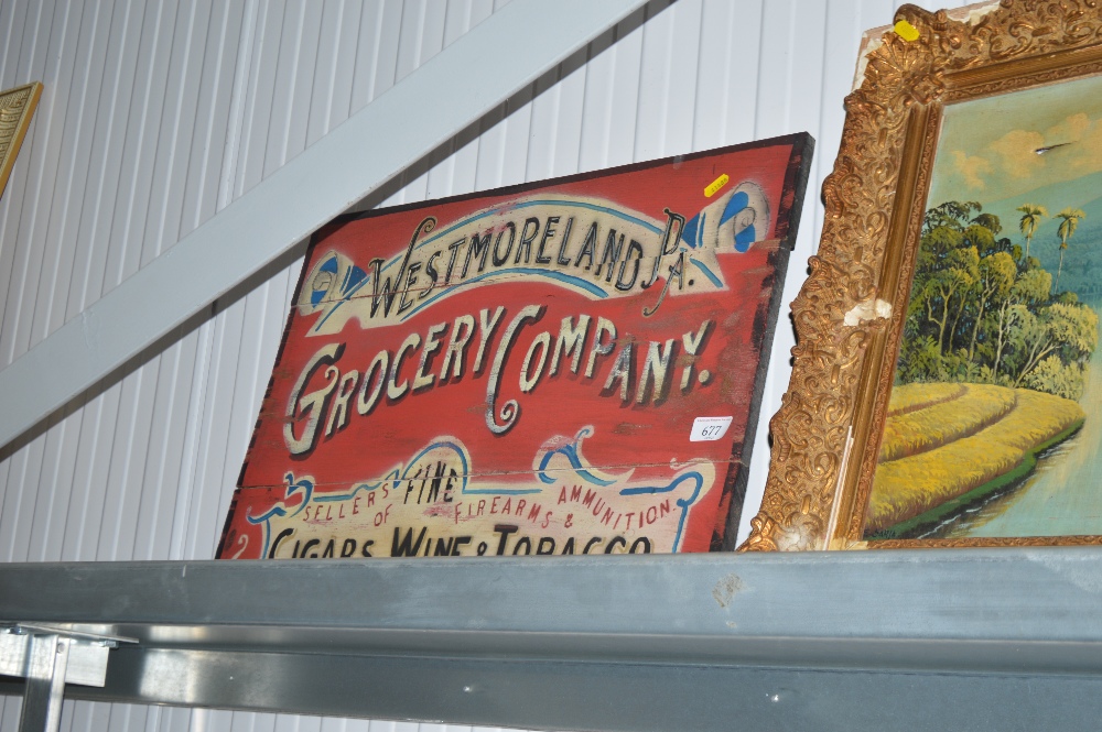 A reproduction wooden advertising sign for the 'We