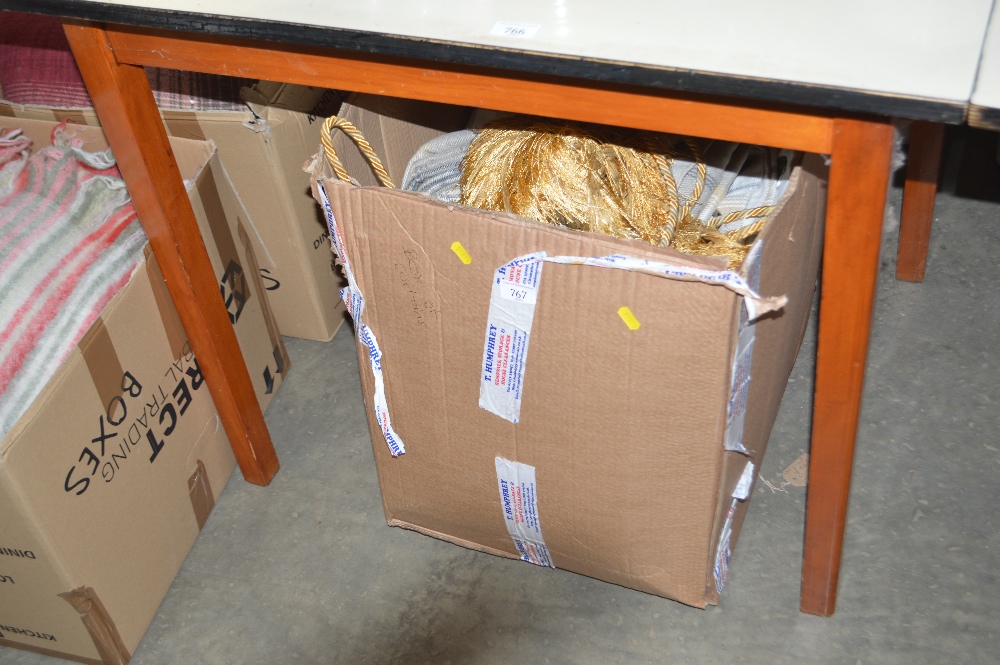 A box of curtains and tie backs