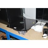 A black glass wall mounted TV bracket