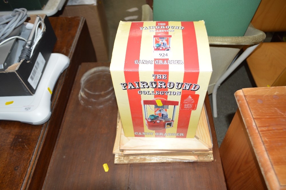 A Fairground Collection candy grabber in a box and