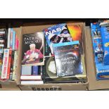 A box of DVDs and books, mainly astronomy and spac