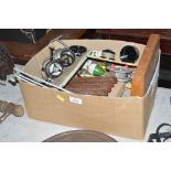 A box of fishing equipment to include reels; float