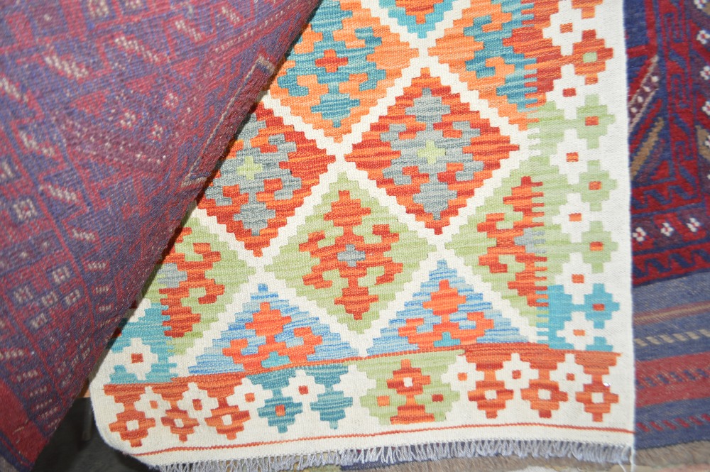 A 4'2" x 2'6" vegetable dye Chobi Kelim rug