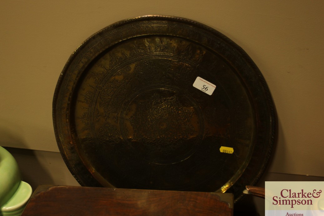 A circular eastern brass tray