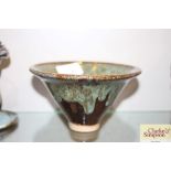 A Studio pottery pedestal bowl decorated with gree