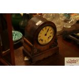 A Victorian walnut mantel clock