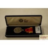 A cased fire brigade long service medal