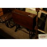 An Edwardian walnut Sutherland tea table