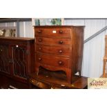 A Victorian mahogany bow fronted bedside chest of