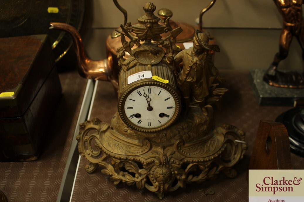 A French gilt metal mantel clock with figural deco