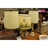 A floral decorated pottery table lamp and shade; a